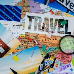This photo shows a range of items linked to travel - a map, some postcards, a calendar, etc.