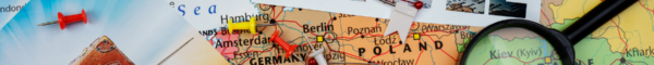 This photo shows a range of items linked to travel - a map, some postcards, a calendar, etc.