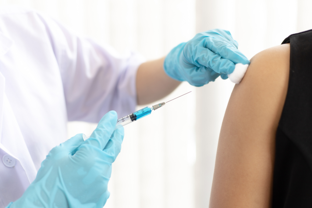 This photo shows a lady getting her travel vaccinations as part of planning for her trip